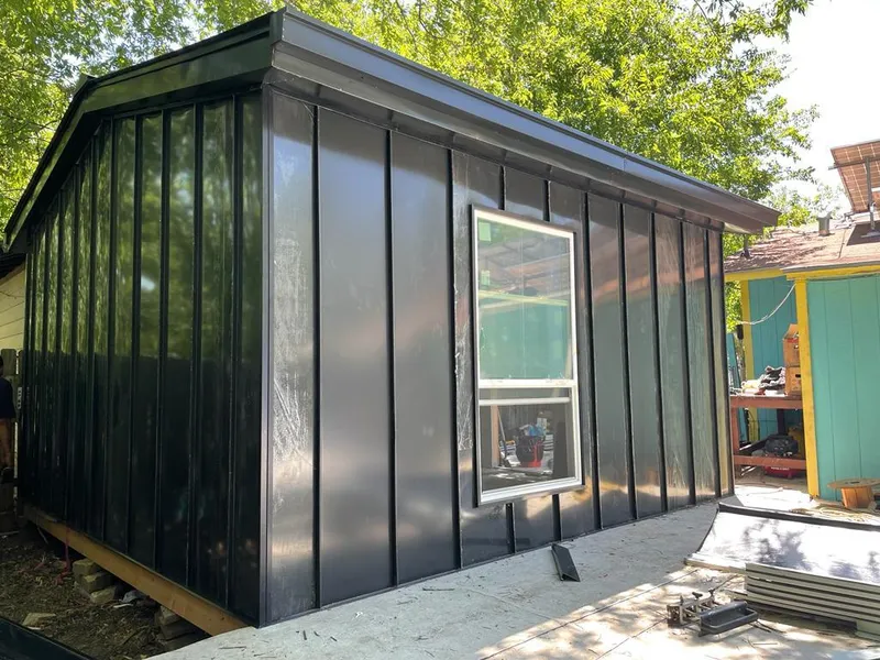 Black standing seam metal wall panels for Roof Inspection in Mercedes