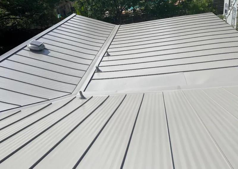 Solar attic fan installed on a metal roof for Roof Ventilation in Mercedes